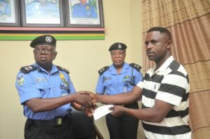 Cross River CP Ajo Geoffrey presents ₦13.75m Group Life Assurance cheques to families of 17 deceased police personnel